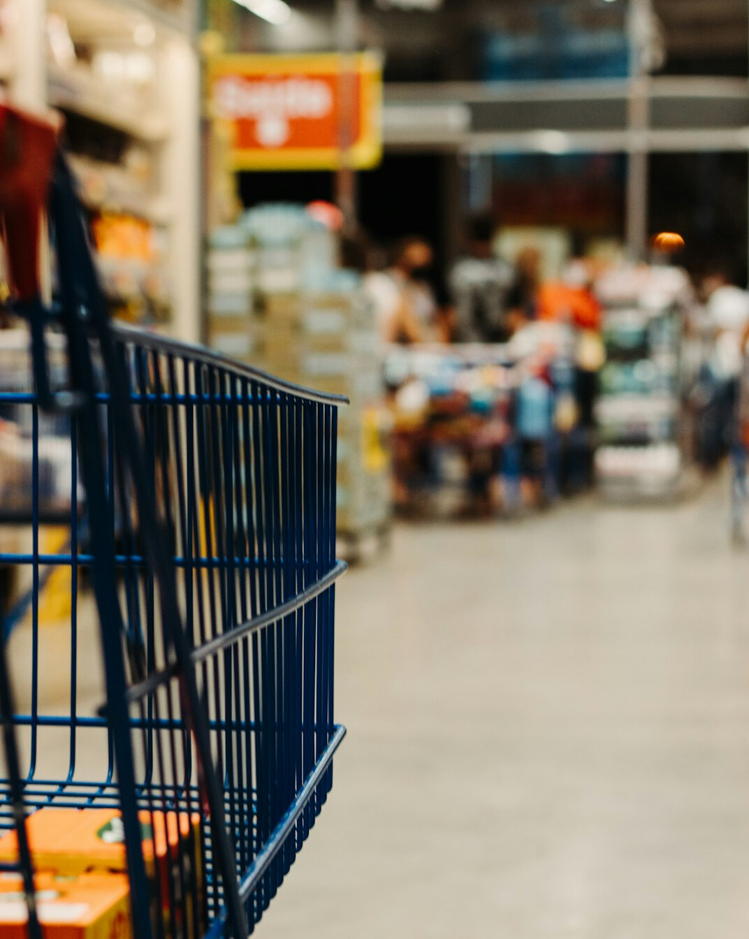 supermarket aisle with shoppers