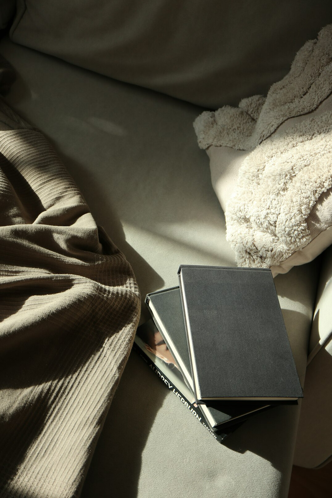 Notebook with pen on a dark wooden desk