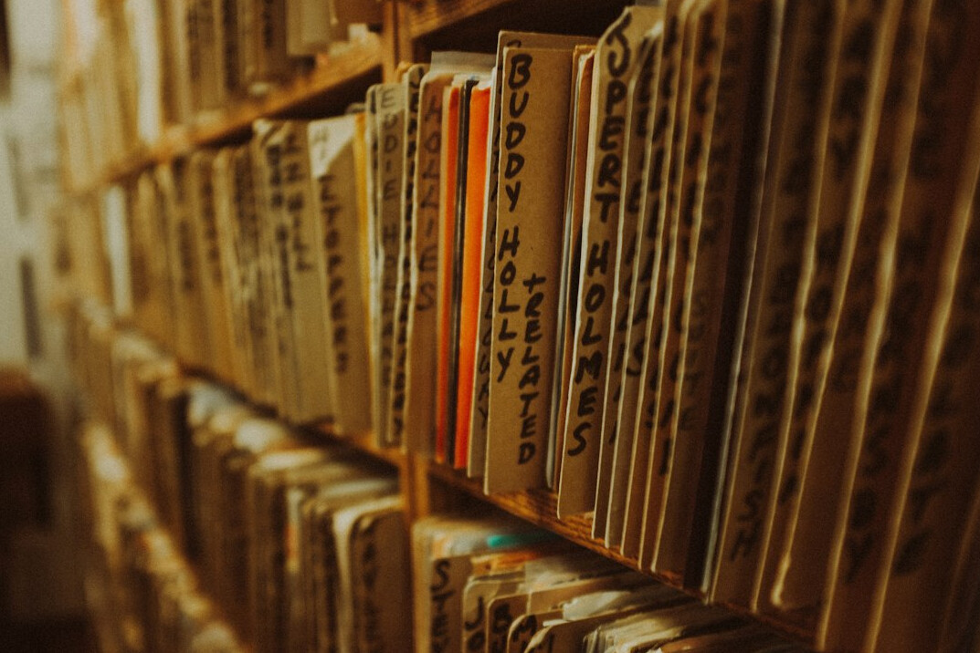 Archive shelves with old folders and documents